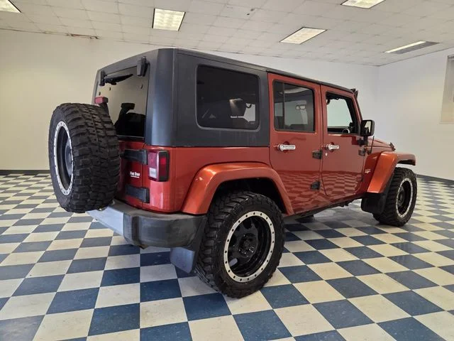 Used 2009 Orange Jeep Unlimited Sahara image 7