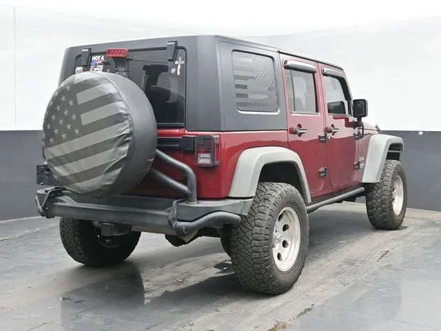 Used 2012 Red Jeep Unlimited Sport image 9