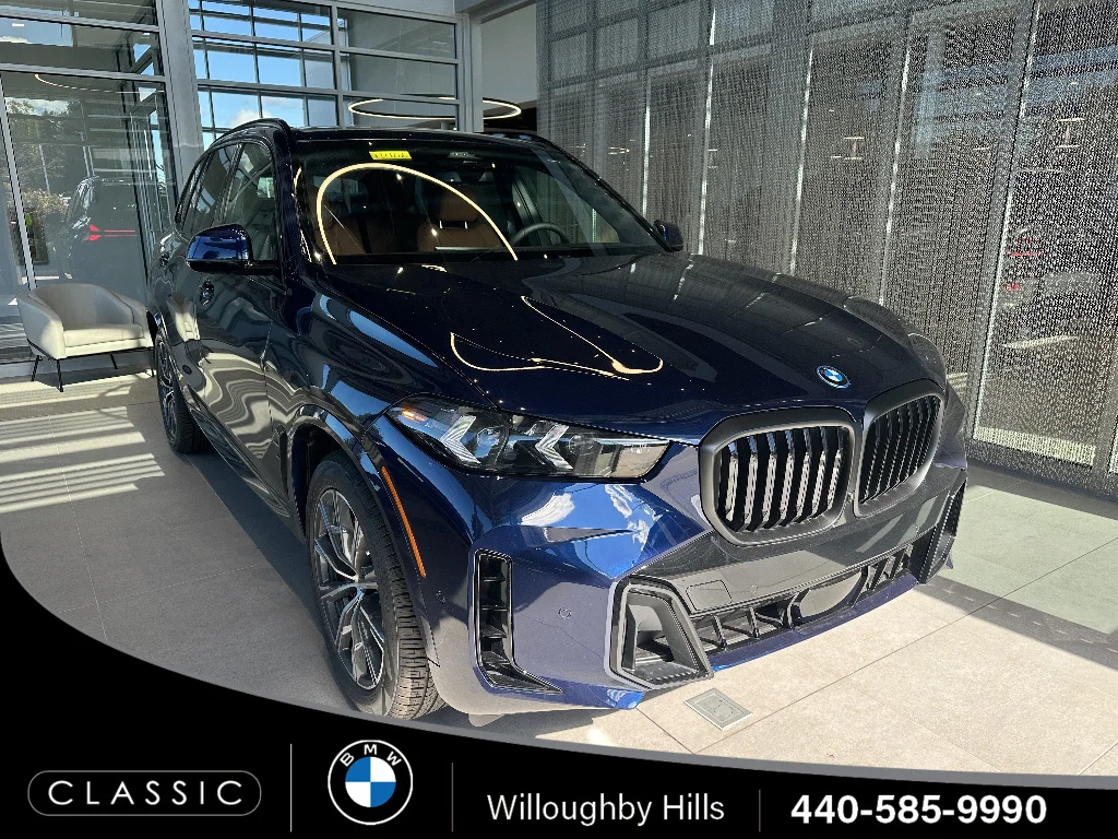 New 2026 Tanzanite Blue II Metallic BMW xDrive50e image 1