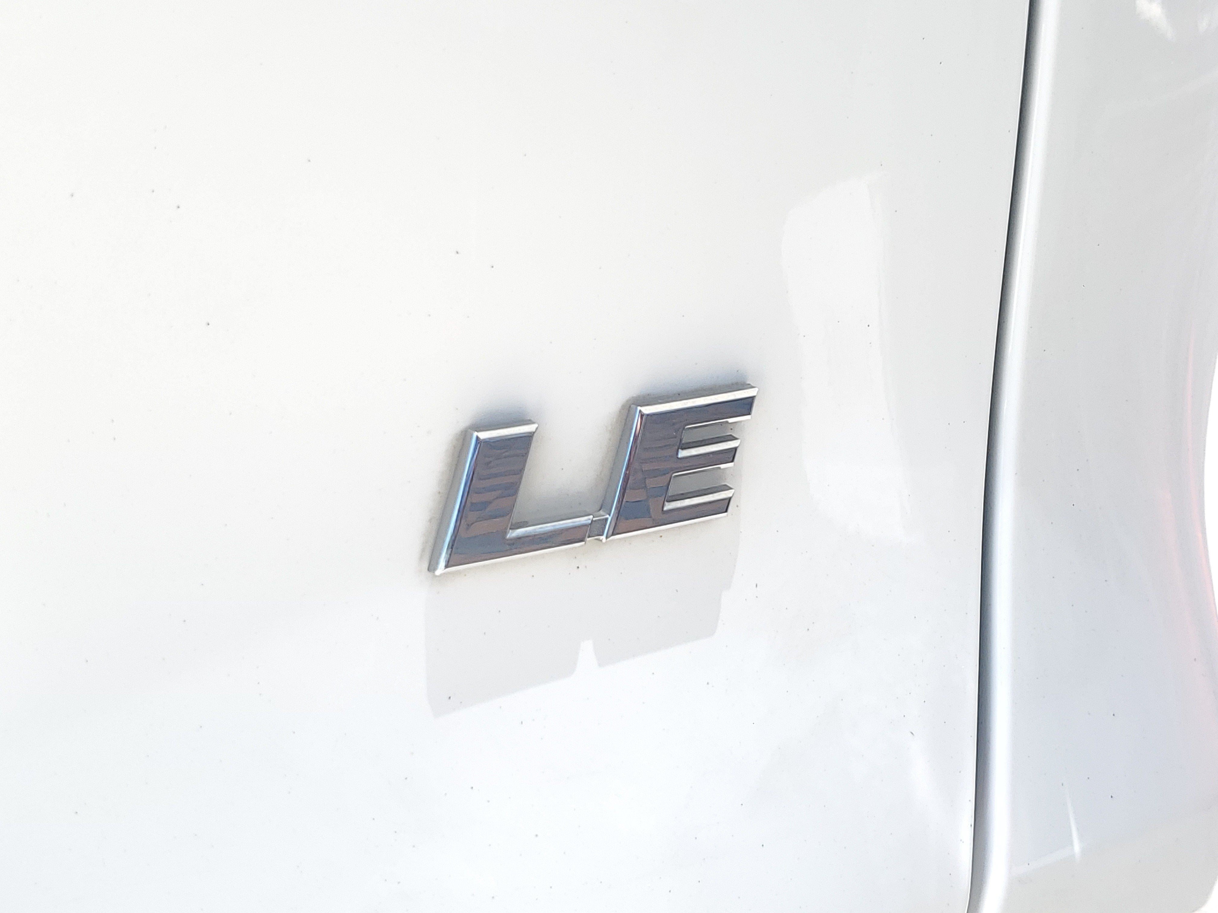 Used 2021 Super White Toyota LE image 8