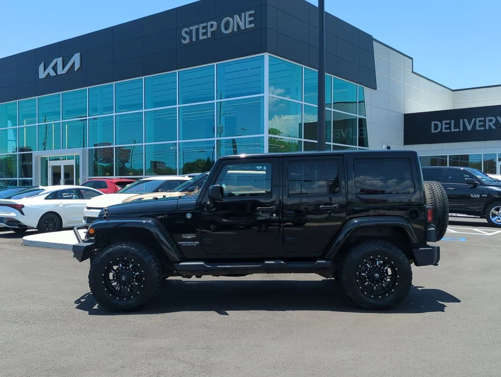 Used 2014 Black Jeep Unlimited Sahara image 4