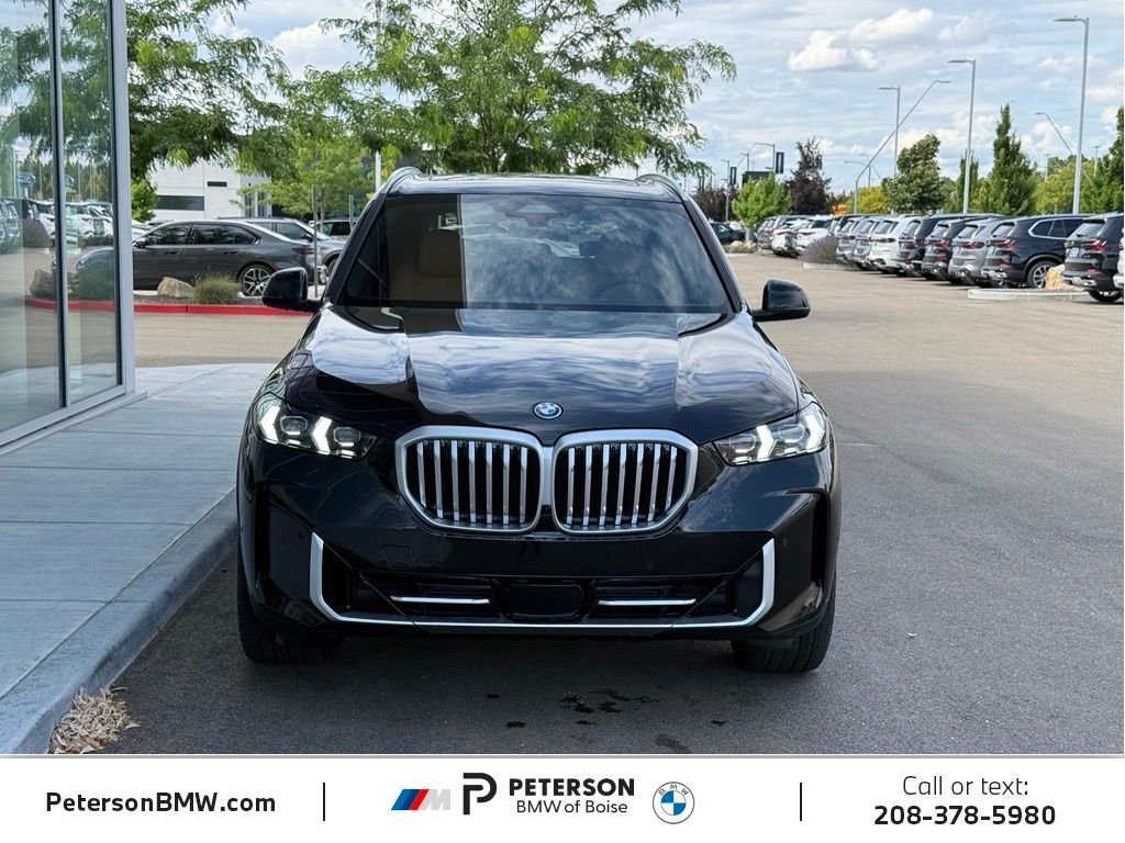 New 2026 Black Sapphire Metallic BMW xDrive50e image 8