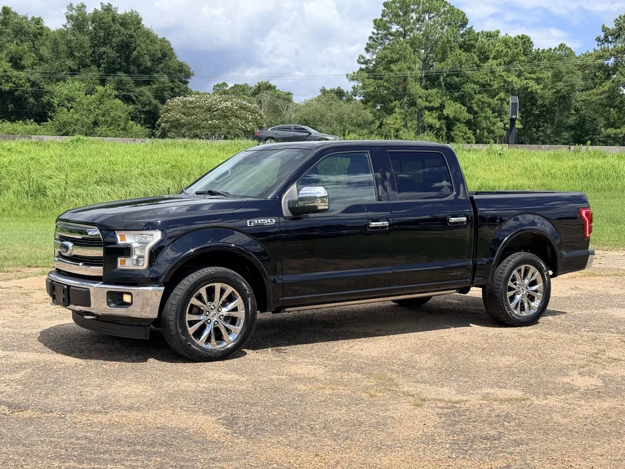 Used 2017 Black Ford Lariat 4x4 4dr SuperCrew 5.5 ft. SB image 1
