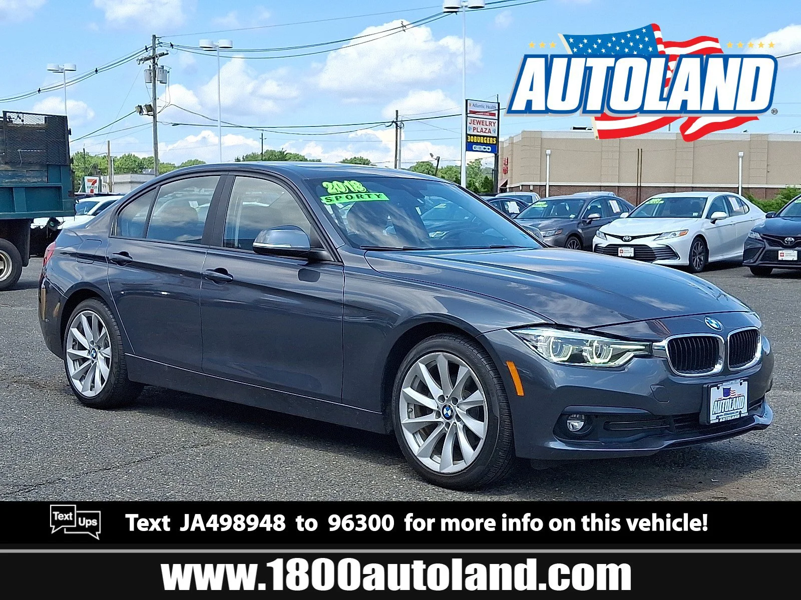 Used 2018 Mineral Gray Metallic BMW 320i xDrive image 1