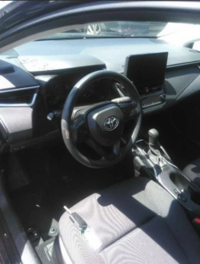 Used 2024 Midnight Black Metallic Toyota LE image 2