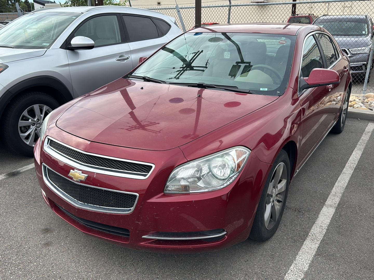 Used 2009 Red Jewel Tintcoat Chevrolet LT w/2LT image 1