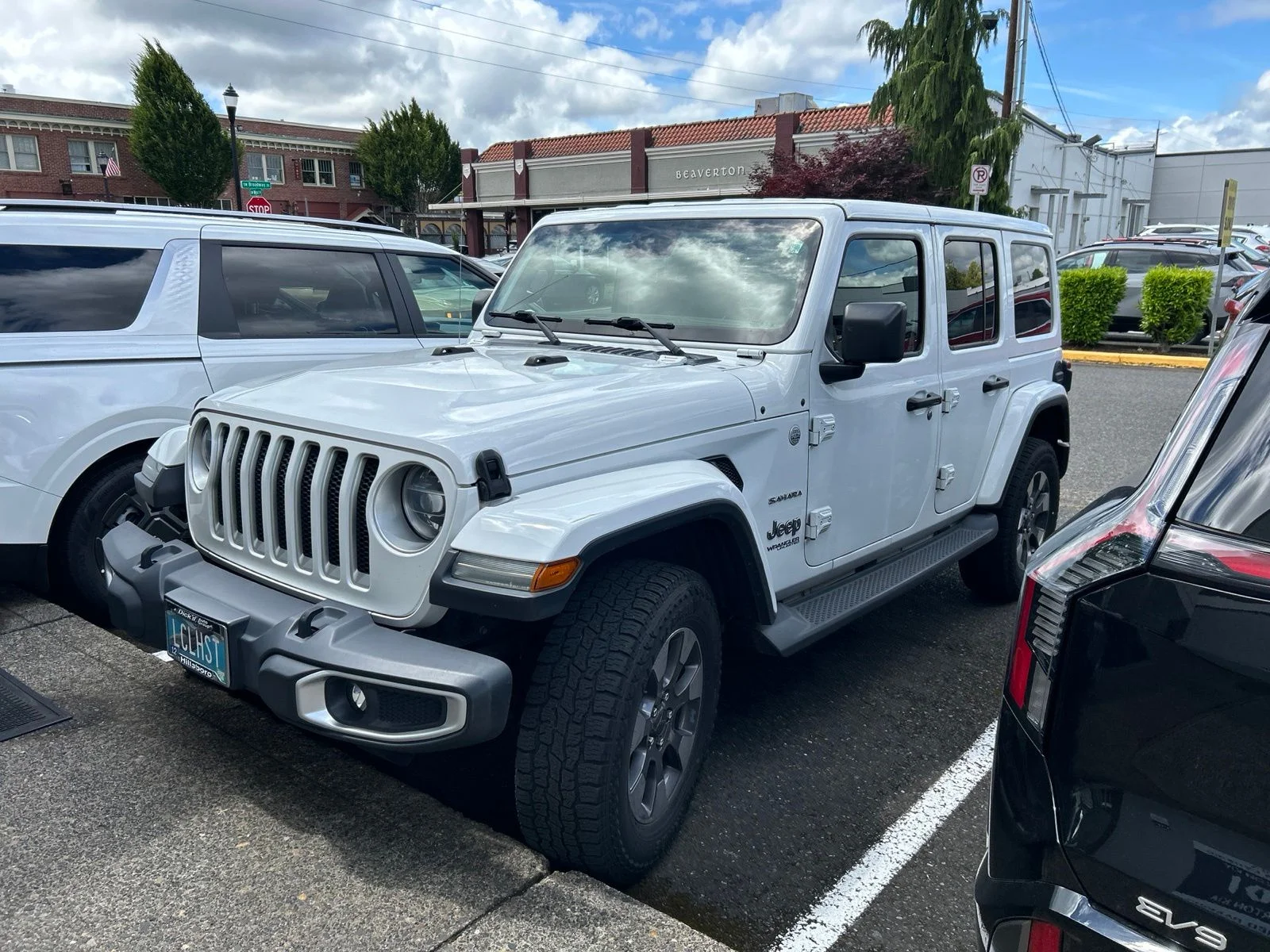 Used 2019 White Jeep Unlimited Sahara image 1