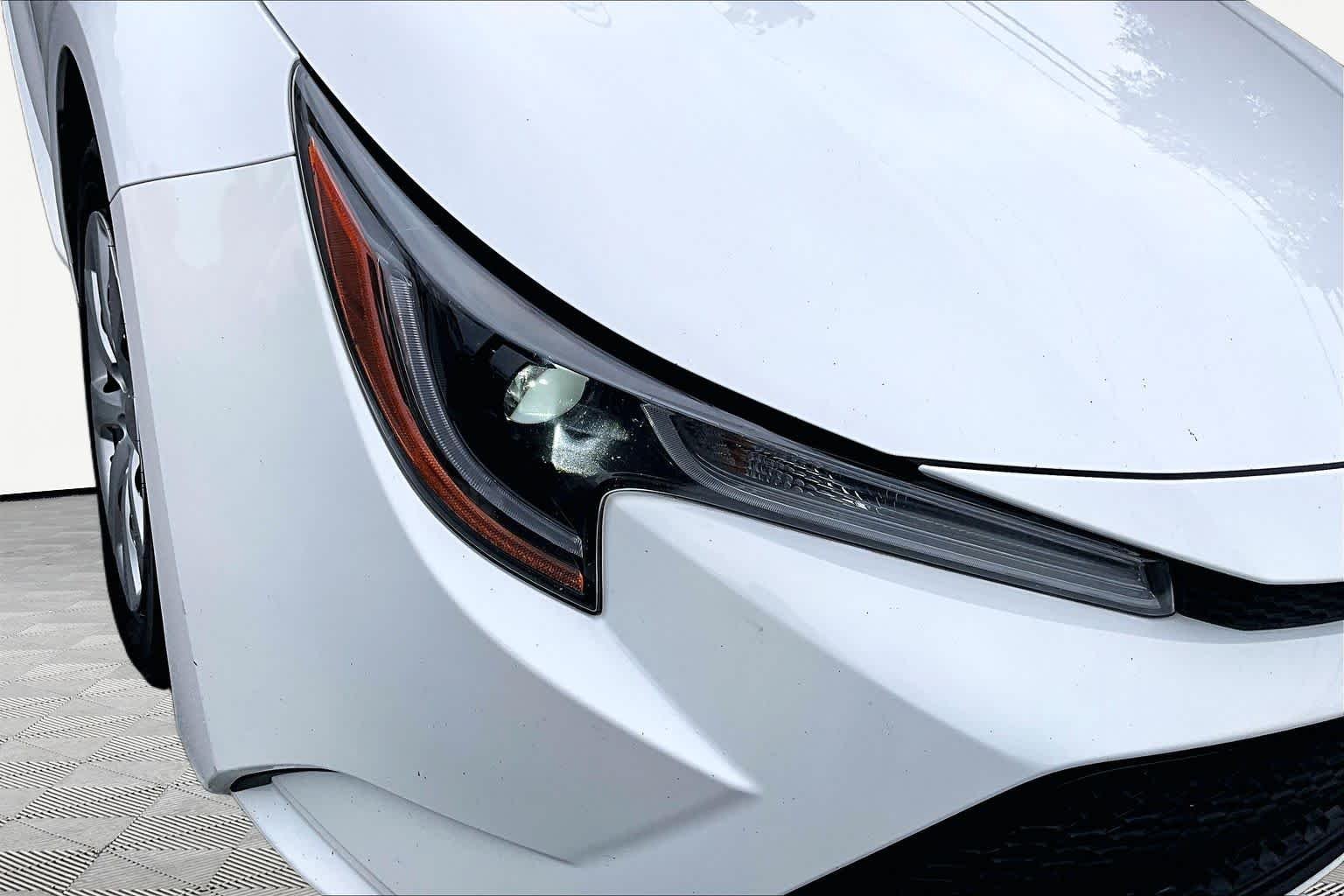Used 2021 Super White Toyota LE image 28