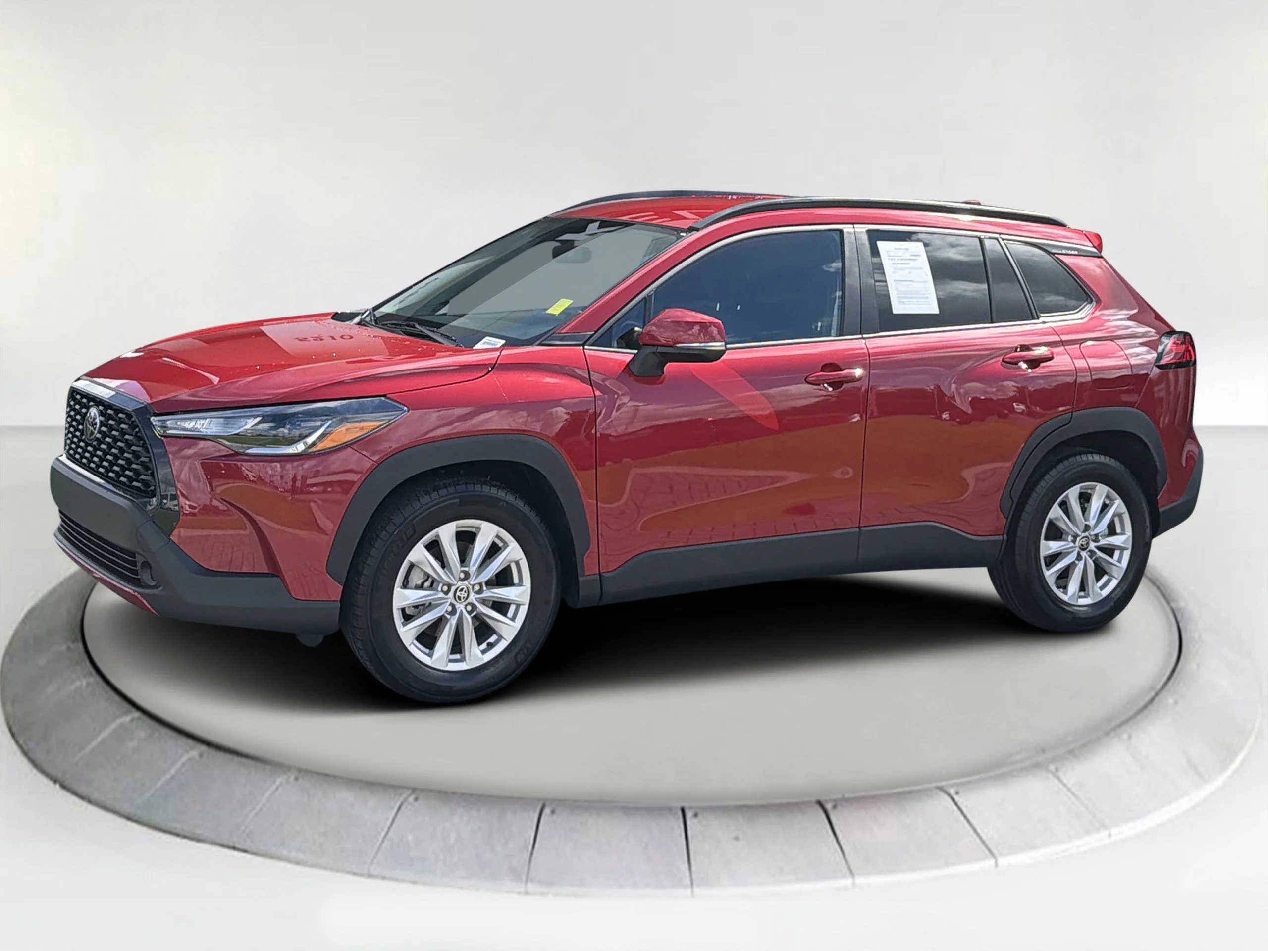 Used 2023 Barcelona Red Metallic Toyota LE image 1