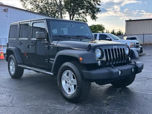 Used 2014 Black Jeep Unlimited Sport image 2