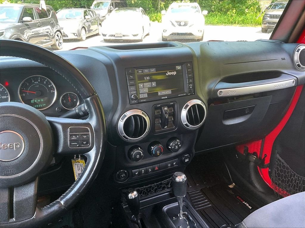 Used 2015 Red Jeep Unlimited Sahara image 17
