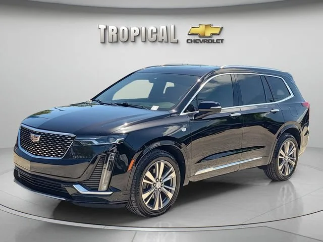 Used 2020 STELLAR BLACK METALLIC Cadillac FWD Premium Luxury image 1
