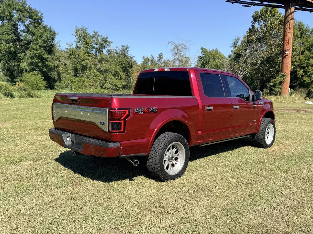 Used 2015 Red Ford Platinum 4x4 4dr SuperCrew 5.5 ft. SB image 6