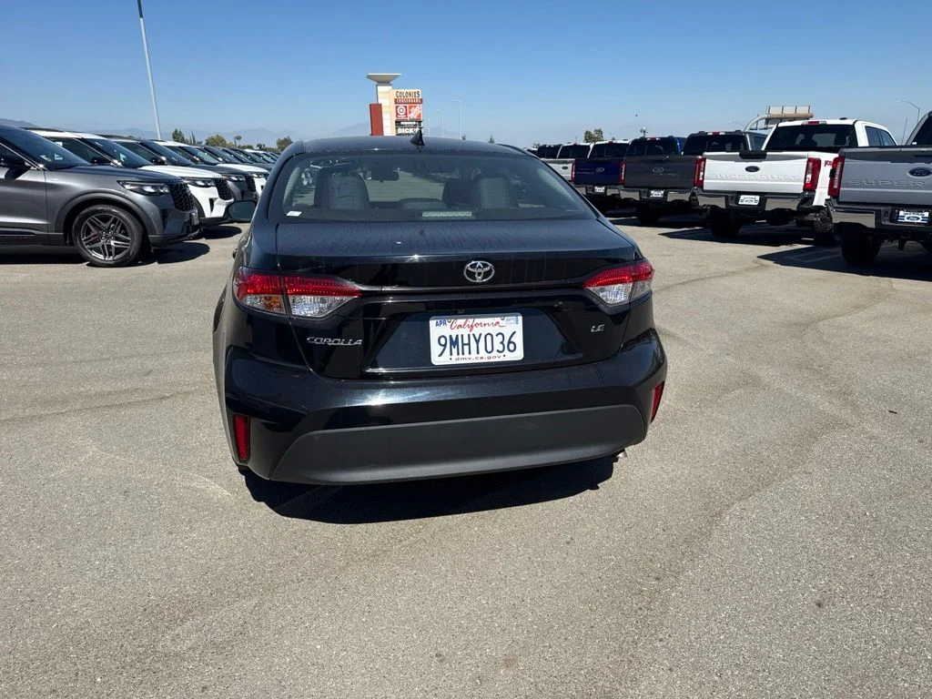 Used 2024 Midnight Black Metallic Toyota LE image 5