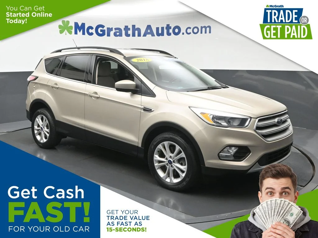 Used 2018 Gold Ford SE image 1
