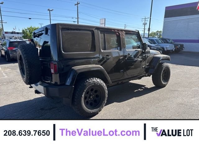 Used 2011 Black Jeep Unlimited Sahara image 4
