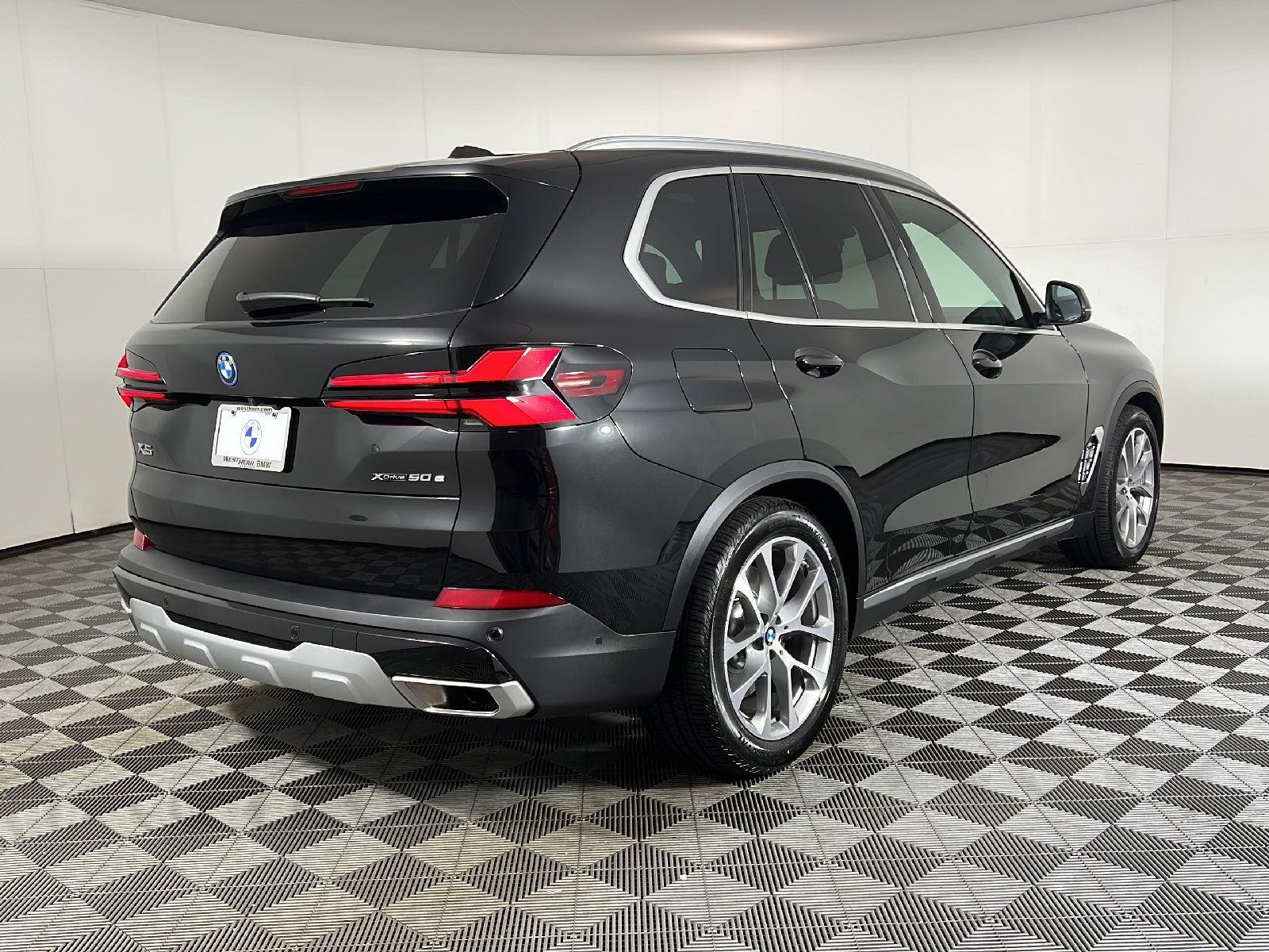 New 2026 Black Sapphire Metallic BMW xDrive50e image 3