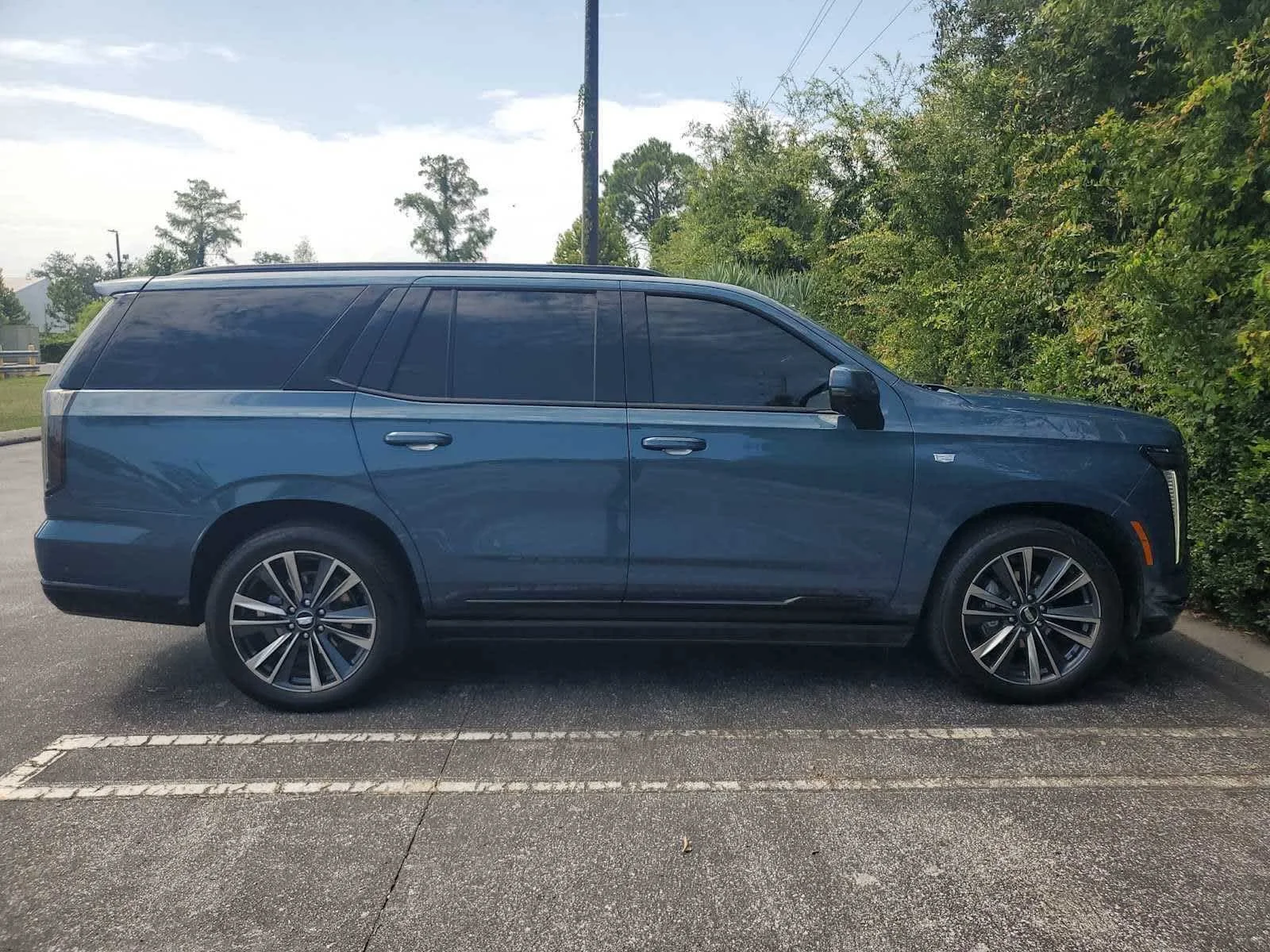 Used 2025 Deep Sea Metallic Cadillac Sport image 6