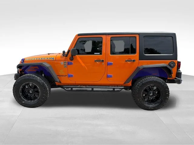 Used 2013 Orange Jeep Unlimited Rubicon image 4
