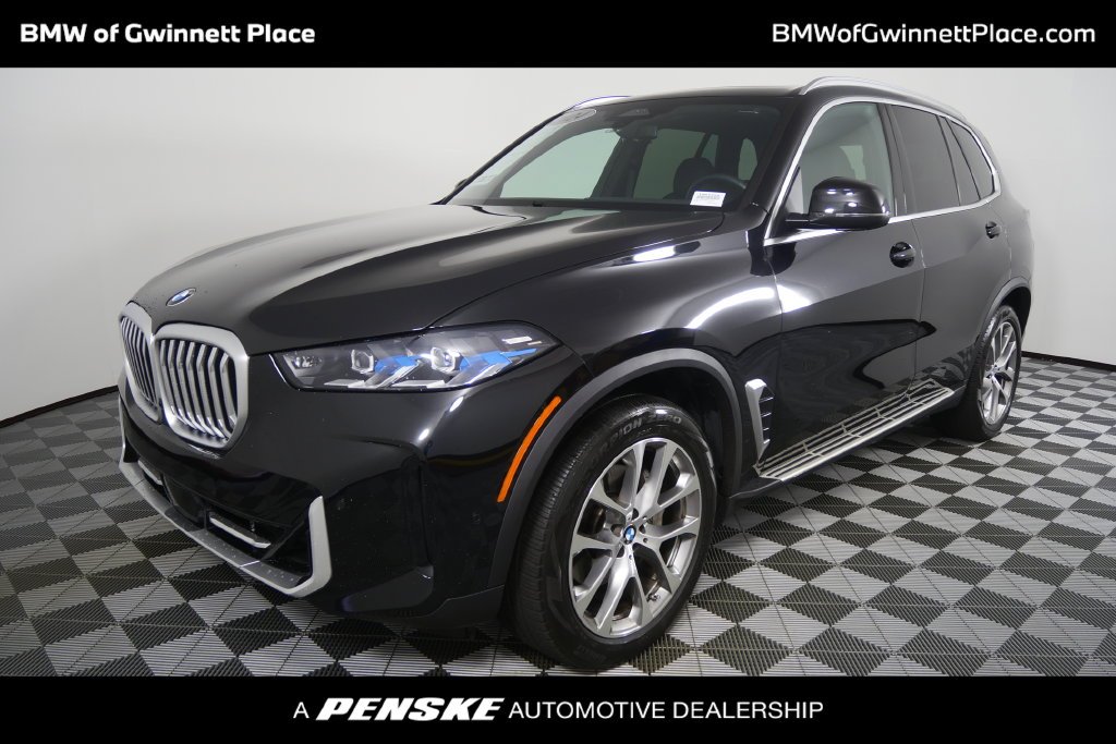 Certified Used 2024 Black Sapphire Metallic BMW sDrive40i image 1