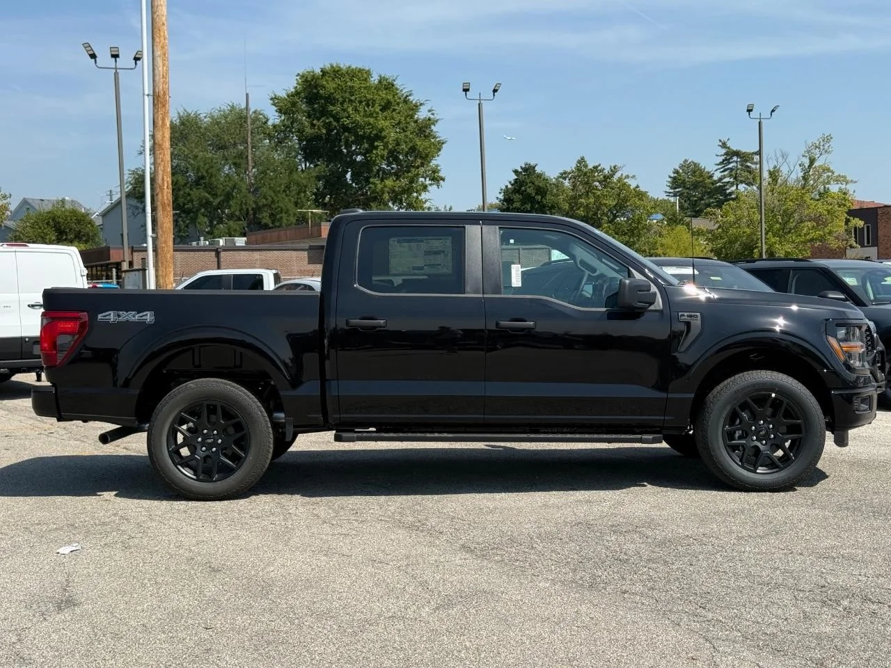 New 2025 Agate Black Metallic Ford STX 4WD SuperCrew 5.5' Box image 2