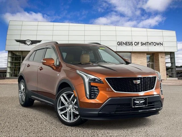 Used 2019 Brown Cadillac Sport image 1