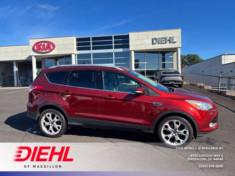Used 2016 Orange Ford Titanium image 1