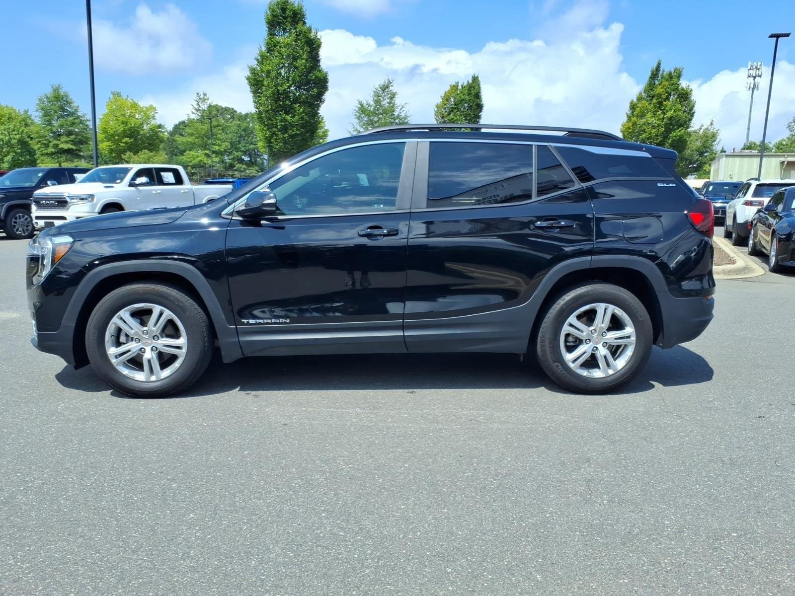 Used 2024 Ebony Twilight Metallic GMC SLE image 3