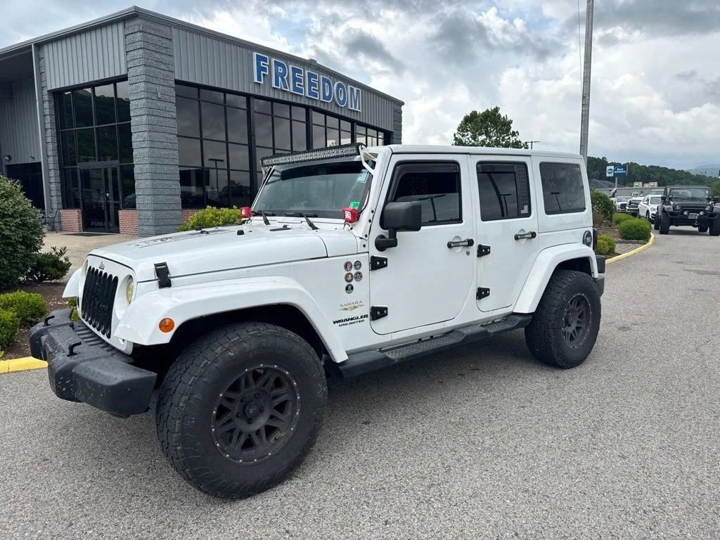 Used 2013 Bright White Jeep Unlimited Sahara image 1