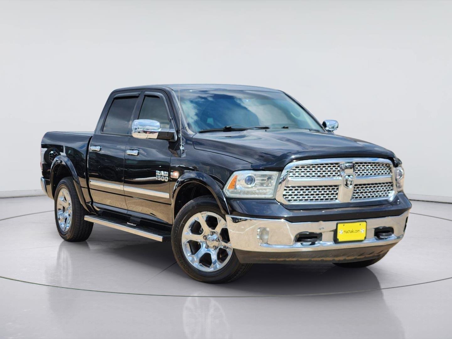Used 2016 Brilliant Black Crystal Pearlcoat Ram Laramie image 1