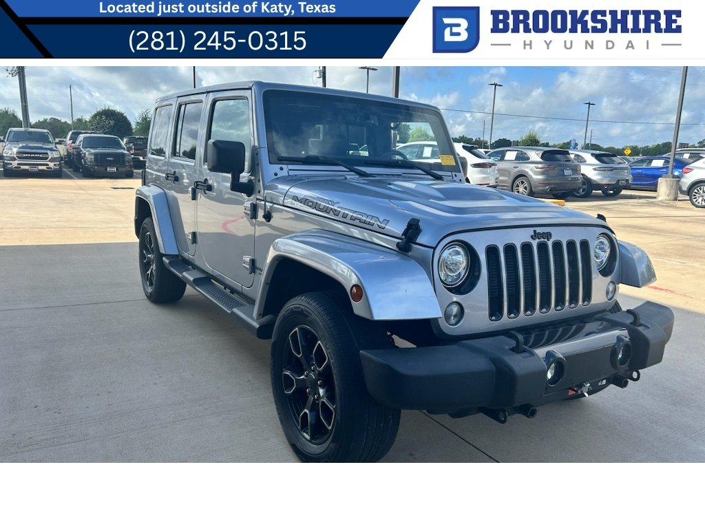 Used 2017 Silver Jeep Unlimited Sahara image 1