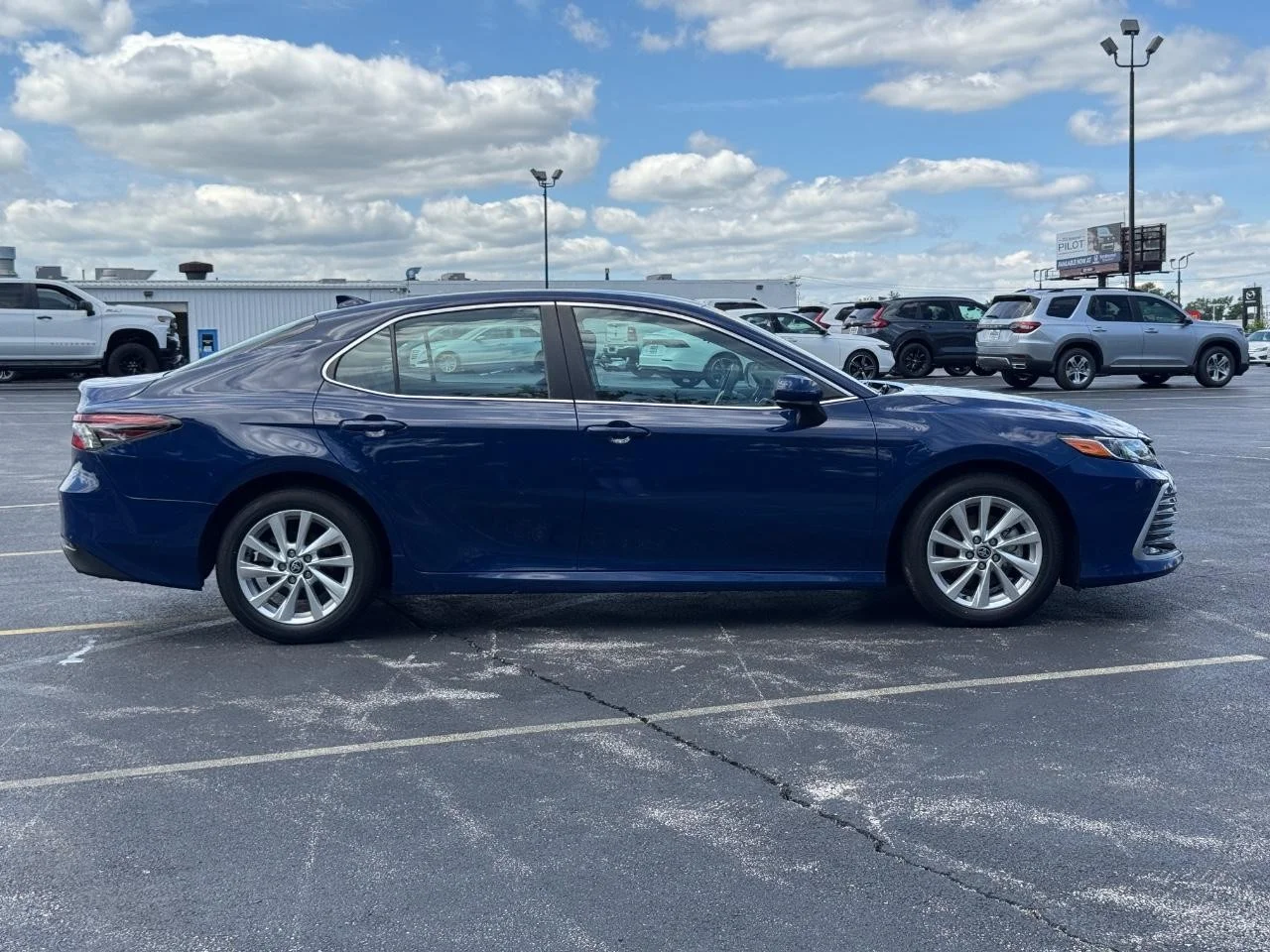 Used 2024 Reservoir Blue Toyota LE image 3