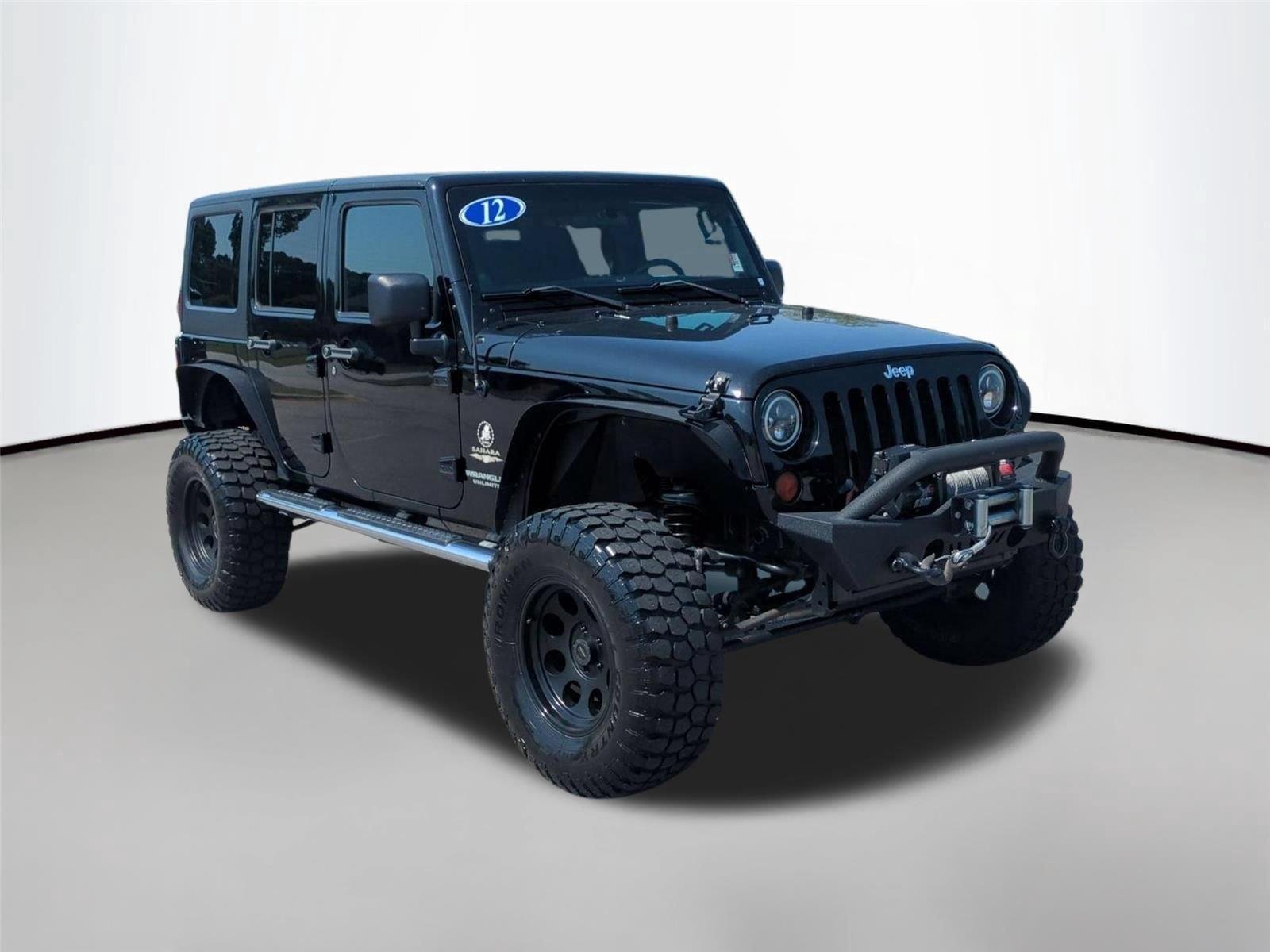 Used 2012 Black Clearcoat Jeep Sahara image 7