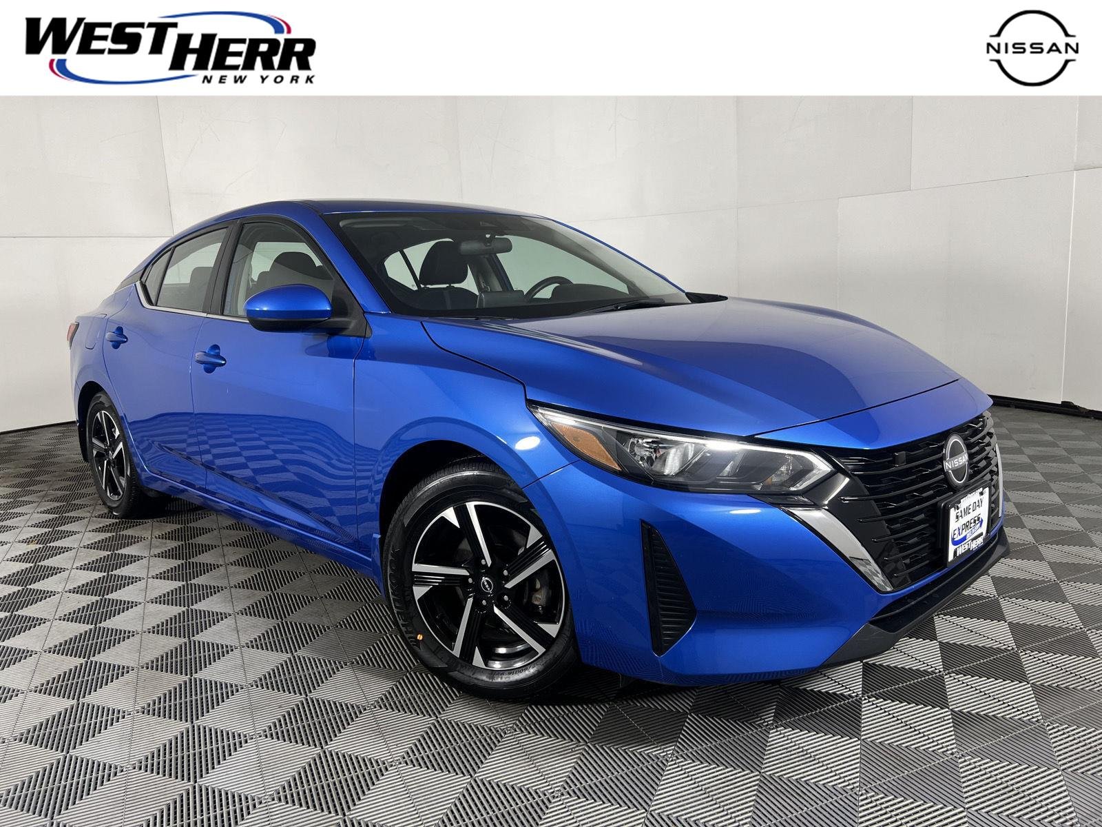 Used 2024 Electric Blue Metallic Nissan SV image 1