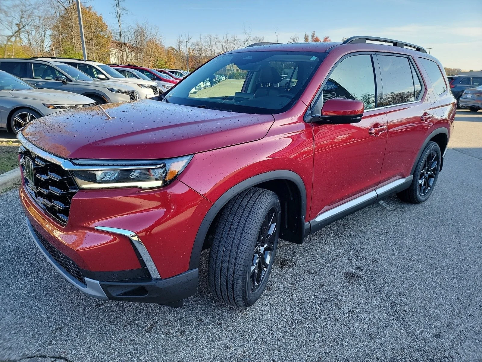Certified Used 2025 Radiant Red Metallic II Honda Touring+ image 1