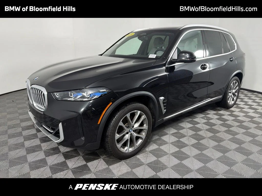 Certified Used 2025 Black Sapphire Metallic BMW xDrive40i image 1