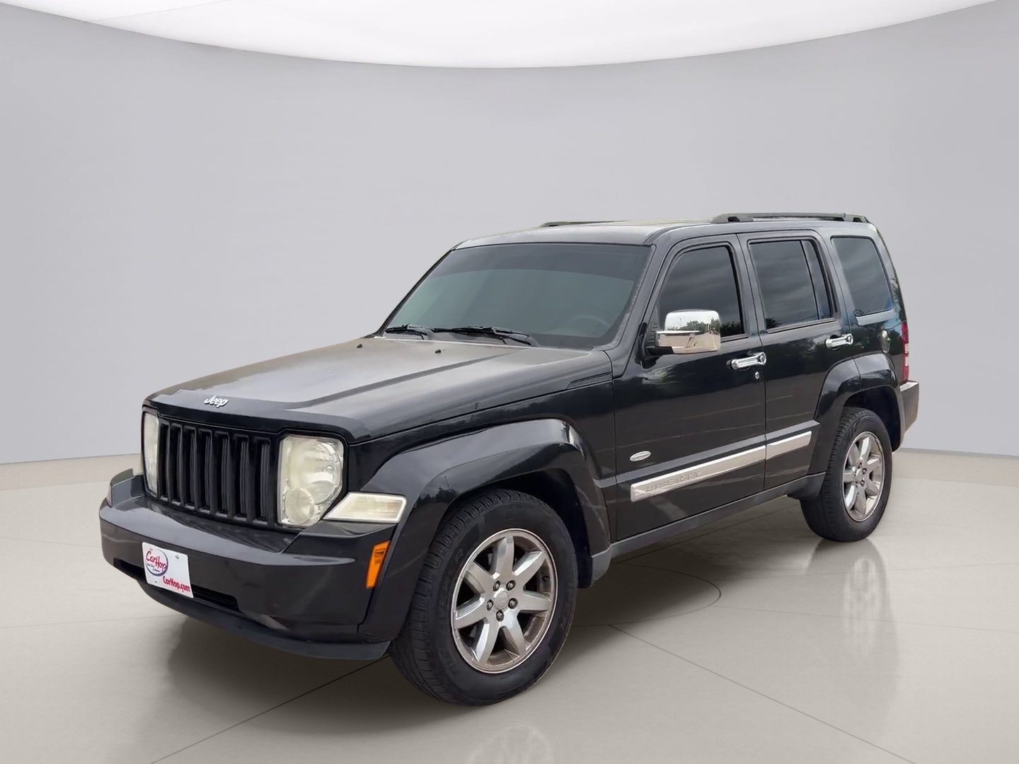 Used 2012 Black Jeep SPORT image 1