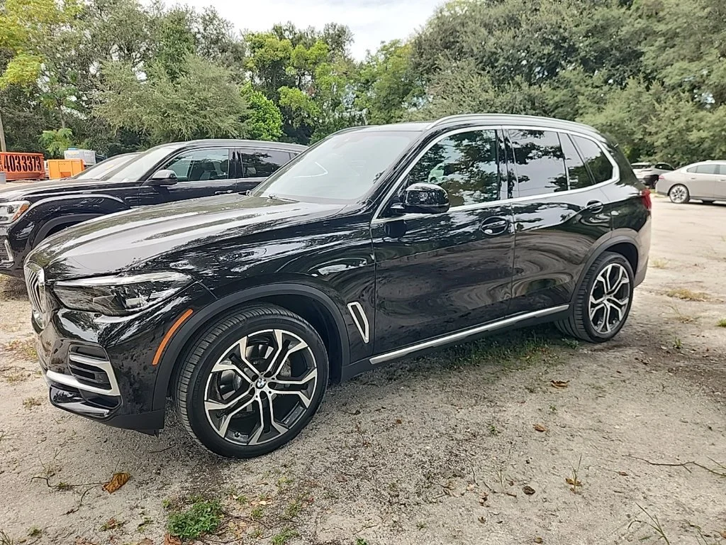 Certified Used 2023 Black Sapphire Metallic BMW sDrive40i image 1