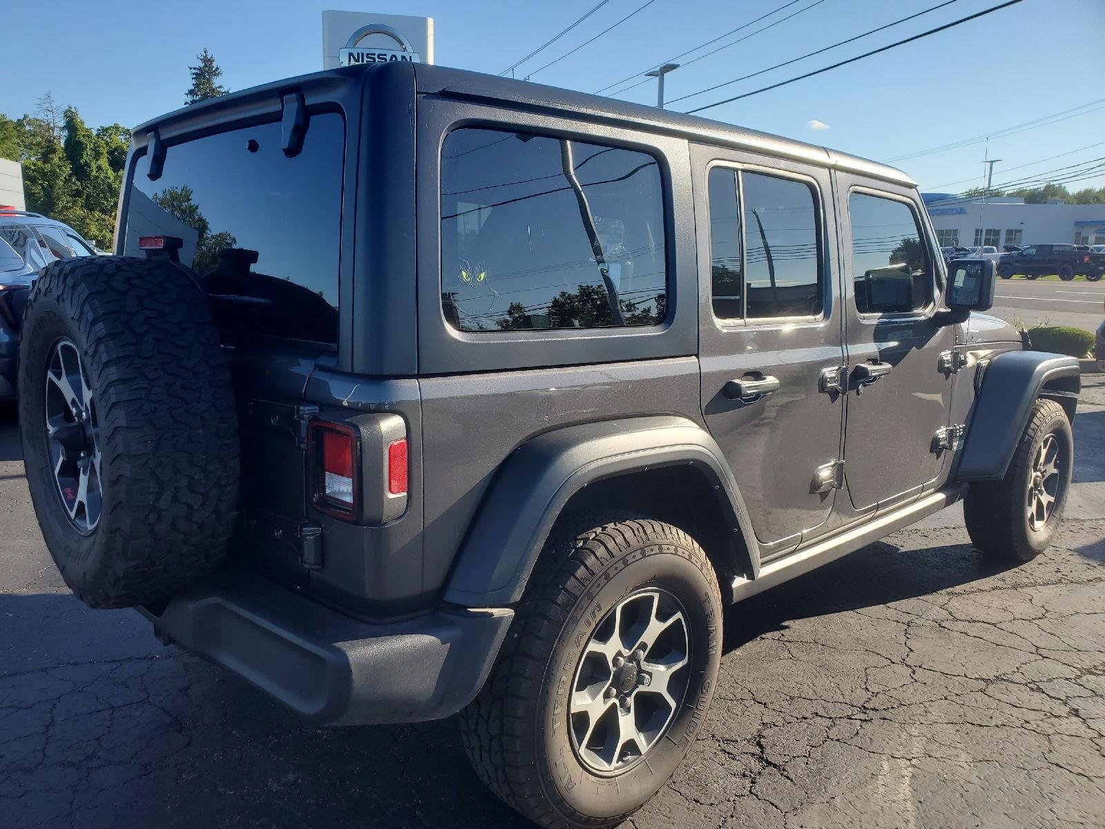 Used 2021 Granite Crystal Metallic Clearcoat Jeep Unlimited Sport S image 2
