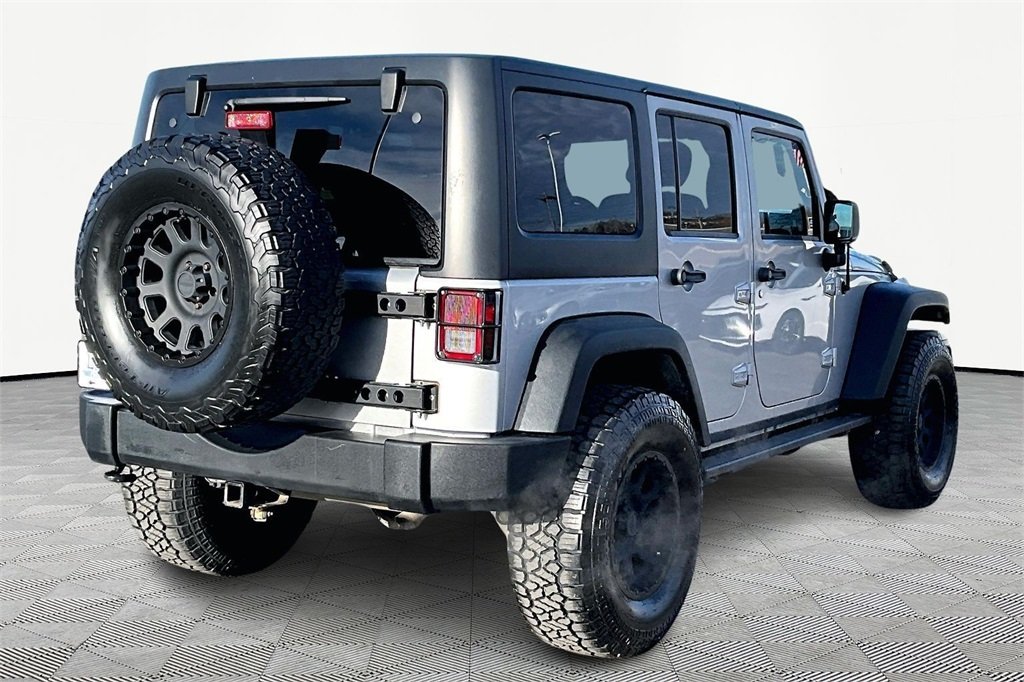 Used 2012 Jeep Wrangler Unlimited Sport with VIN 1C4BJWDG4CL283828 for sale in Kansas City