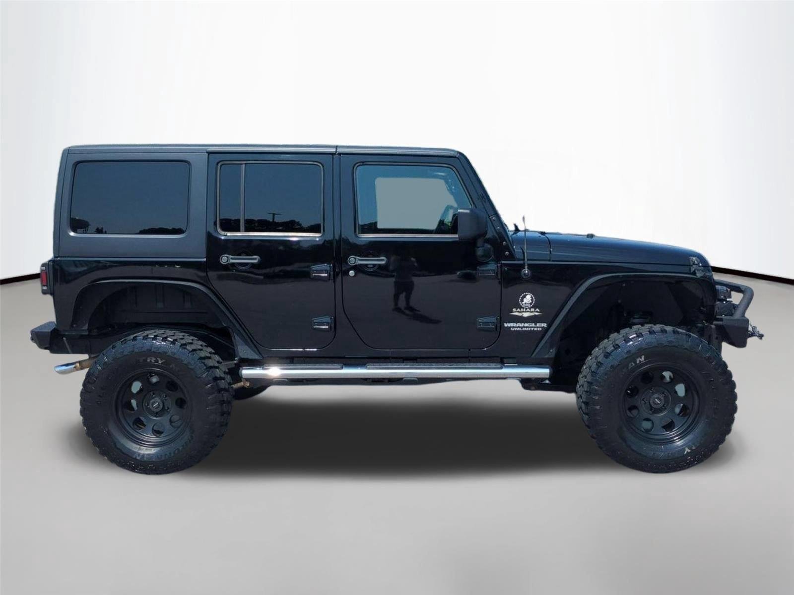 Used 2012 Black Clearcoat Jeep Sahara image 6