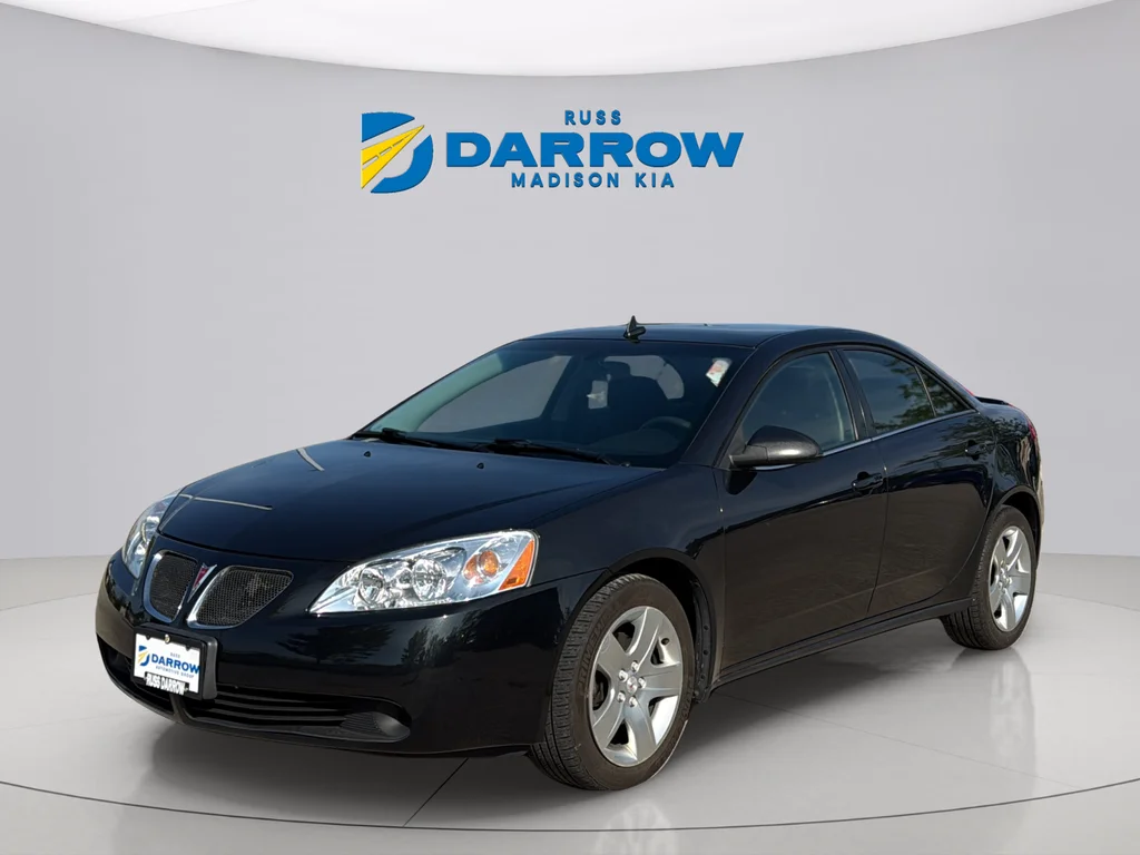 Used 2009 Carbon Black Metallic Pontiac Base image 1