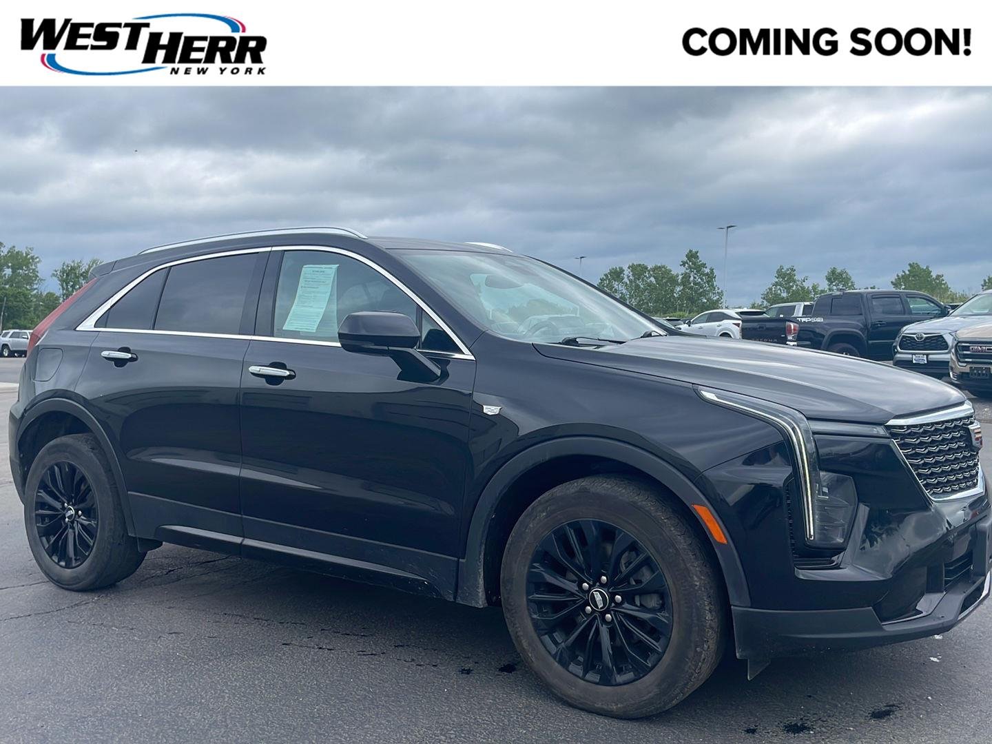 Used 2024 Stellar Black Metallic Cadillac AWD Premium Luxury image 1
