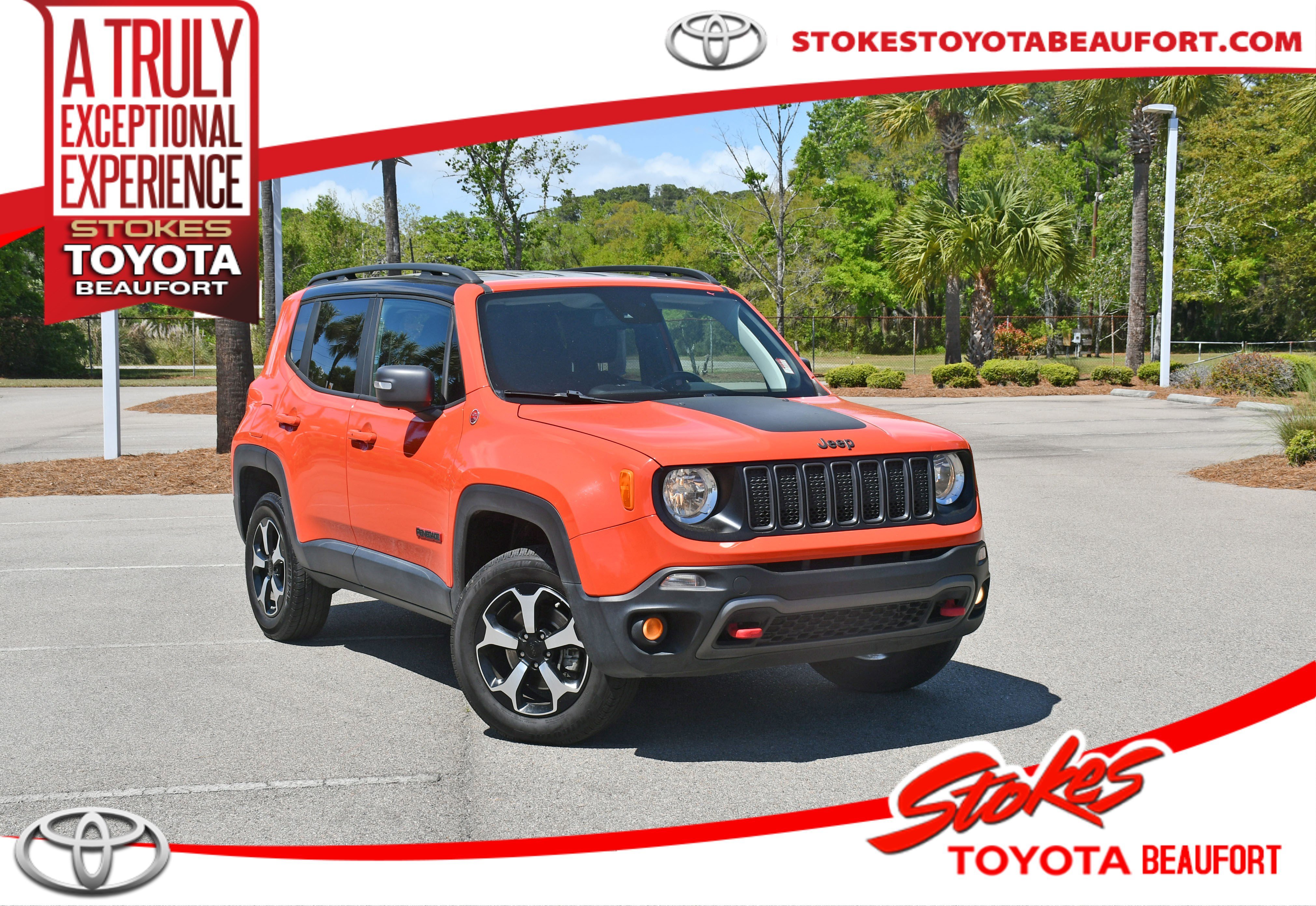 Used 2021 Orange Jeep Trailhawk image 1