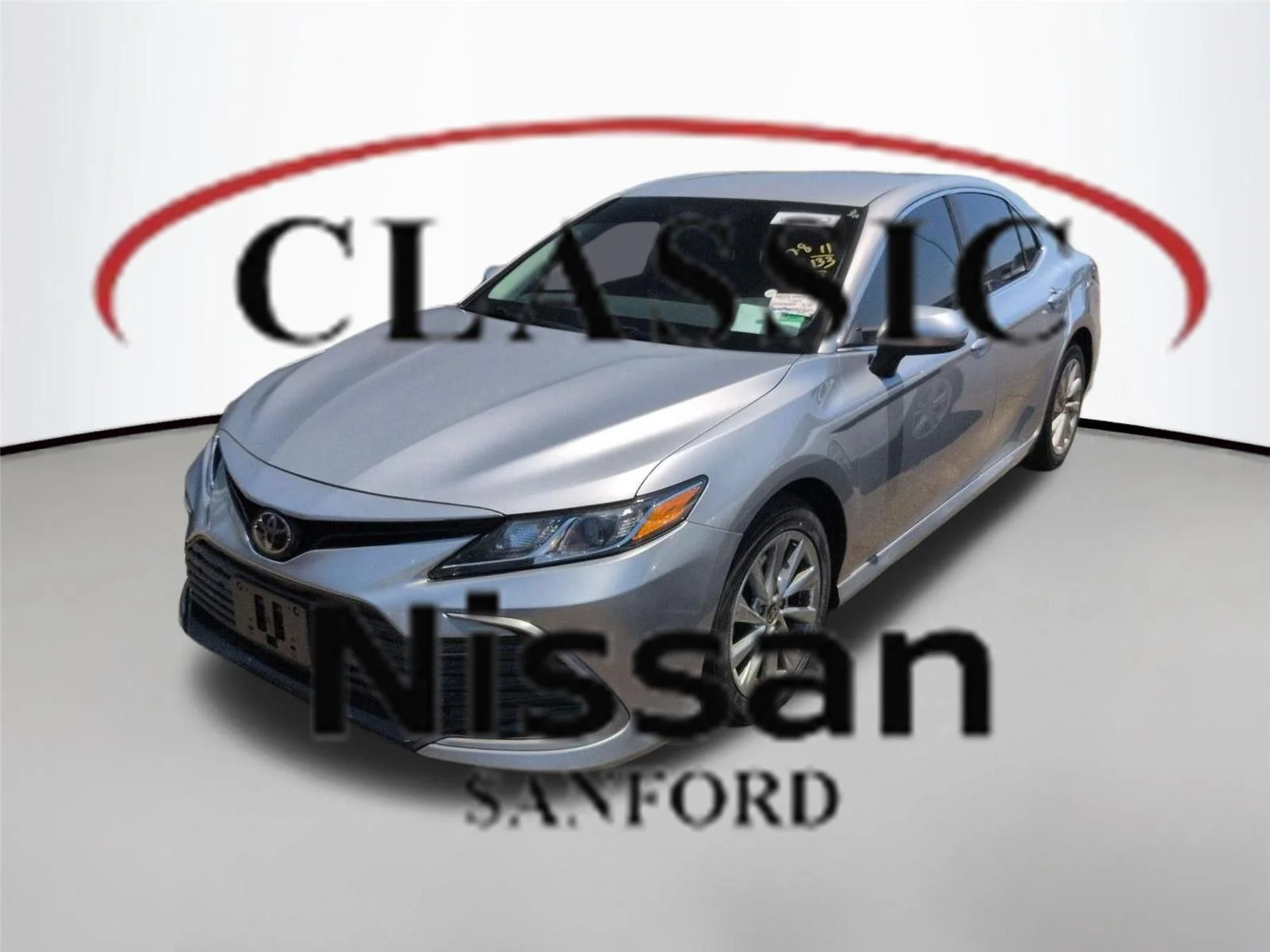 Used 2021 Celestial Silver Metallic Toyota LE image 1