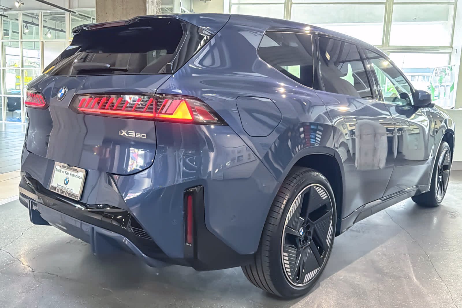 New 2027 Ocean Wave Blue Metallic BMW 50 xDrive image 2