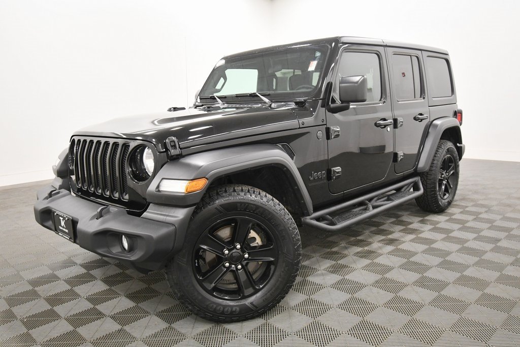 Used 2023 Jeep Wrangler 4-Door Altitude with VIN 1C4HJXDG7PW550075 for sale in Rochester, Minnesota