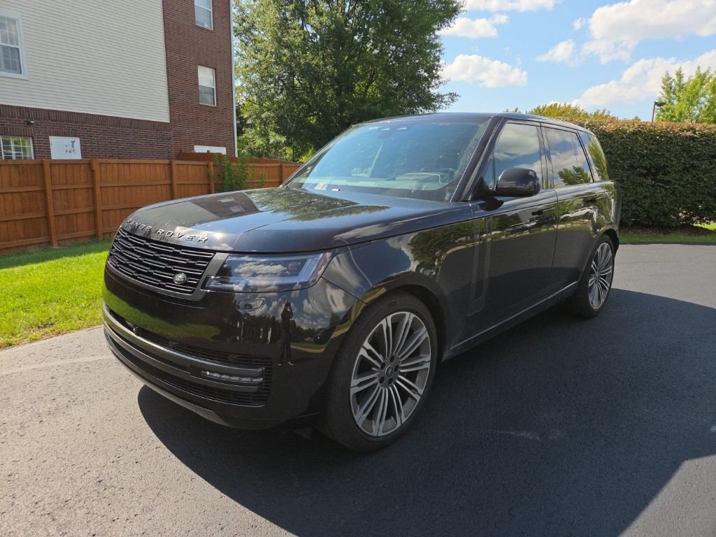 Used 2025 Santorini Black Metallic Land Rover SE image 1