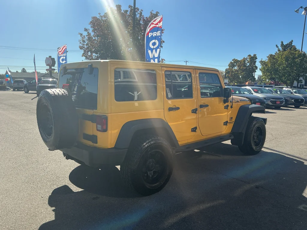 Used 2015 Baja Yellow Jeep Sport image 5