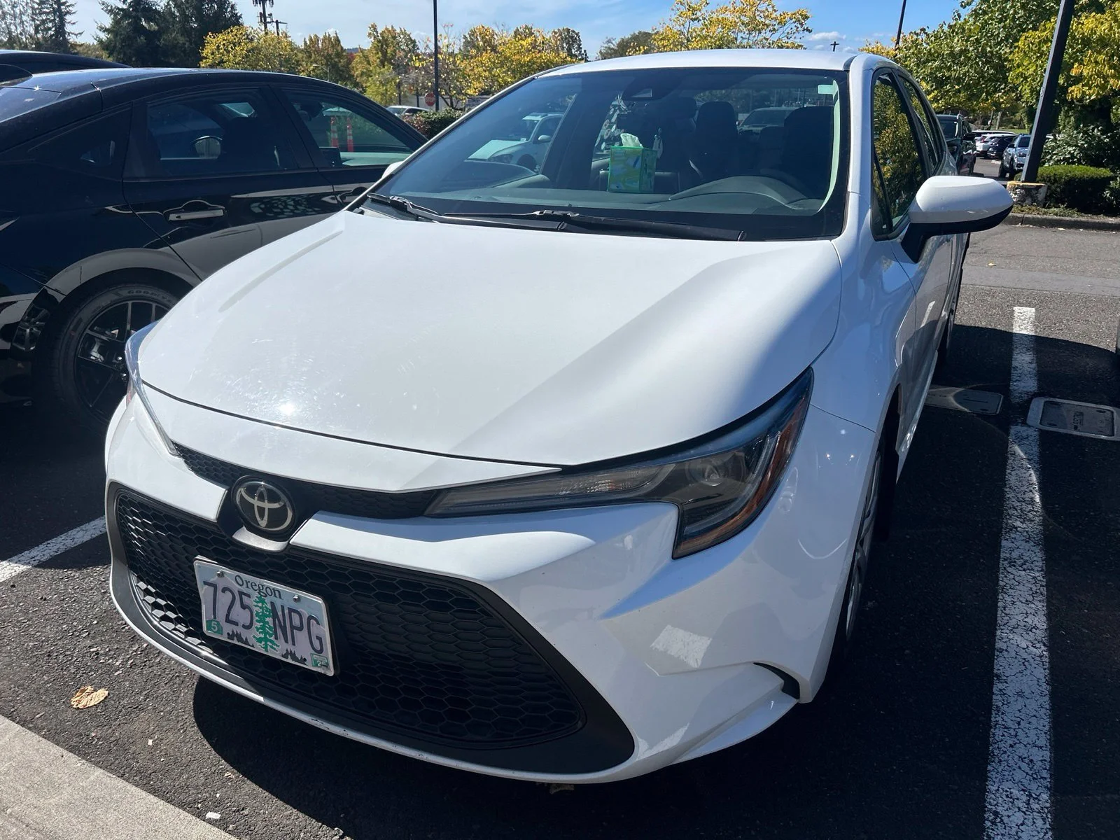Used 2021 Super White Toyota LE image 2
